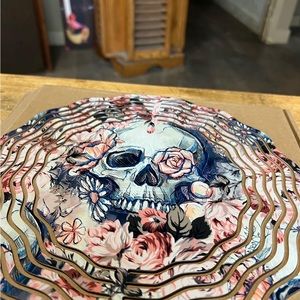 Brand new 10in skull and flowers wind spinner